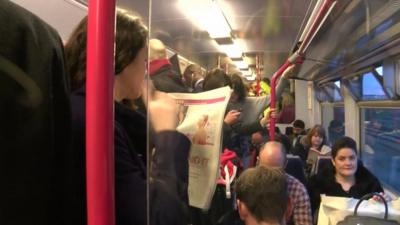 Commuters on a Thameslink train