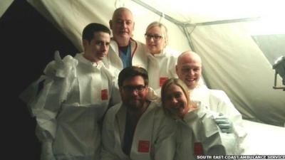 Chris Williams (top centre) in an Ebola training session with colleagues