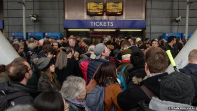 Travellers crowded in front of Finsbury Park ticket office