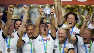 England Women's ruby team lifting the world cup