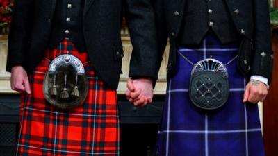 Kilts and sporrans of wedding couple