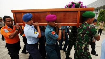 First coffin taken back to airport