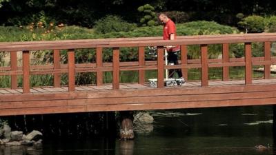 Darek Fidyka walks on bridge