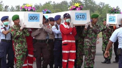 Coffins of the dead from the AirAsia flight