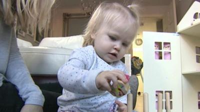 Baby playing with toys