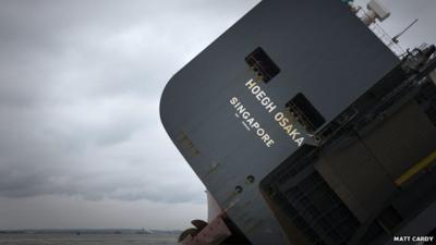 Close up of stranded ship the Hoegh Osaka on her side on a sandbank in the Solent