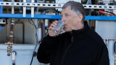 Bill Gates drinks a glass of water produced from human waste