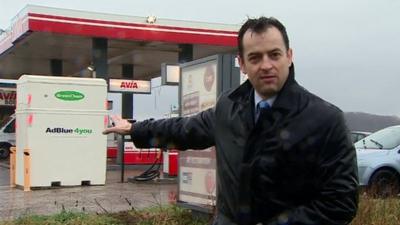 Damian Grammaticas at petrol station