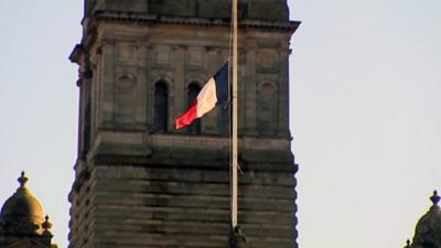 French flag at half mast over Glasgow City Chambers