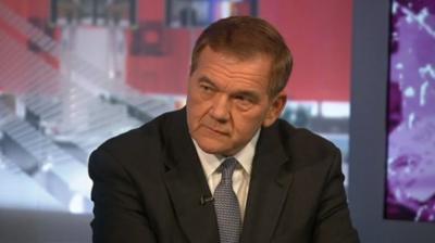 Tom Ridge seated on BBC World News America