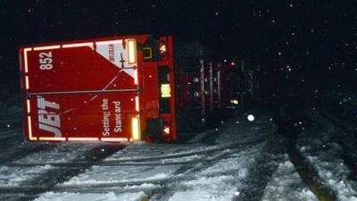 Overturned lorry in snow in Drumochter, Scottish Highlands