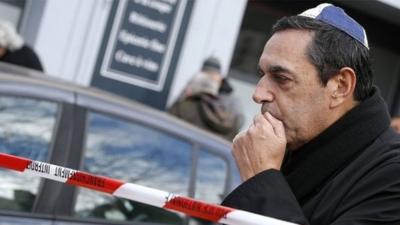 A man wearing a Jewish skullcap at a memorial to the victims of the attack on the kosher grocery store in Porte de Vincennes, eastern Paris - 10 January 2015