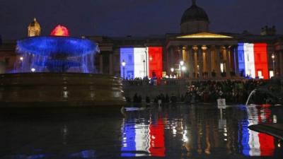 The colours of the French flag light up Trafalgar Square