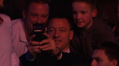 Chelsea captain John Terry takes a number of selfies with fans