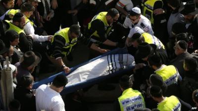 Mourners carry the body of Yoav Hattab at a Jerusalem cemetery