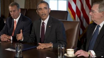 President Barack Obama, flanked by House Speaker John Boehner of Ohio, left, and Senate Majority Leader Mitch McConnell