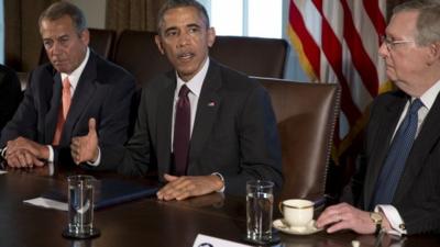 President Barack Obama, flanked by House Speaker John Boehner of Ohio, left, and Senate Majority Leader Mitch McConnell