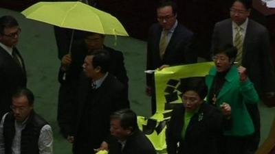 Pro-democracy MPs march through Hong Kong's legislature