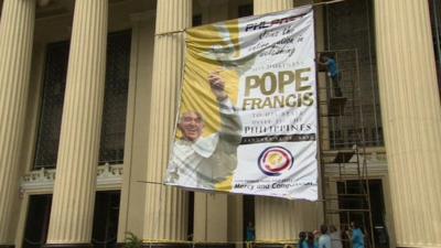 Banner showing Pope Francis