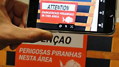 Google Translate translates a sign which reads Attention Dangerous piranhas in this area