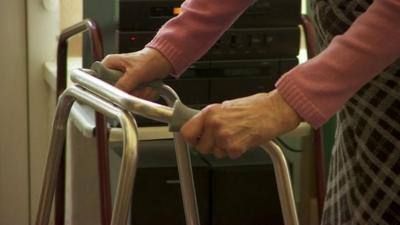 Woman using a walking frame