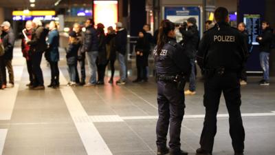 Police officers at the main Hauptbahnhof railway station in Berlin on 17 January 2015