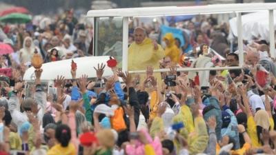 Popemobile travelling through park in Manila