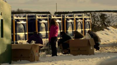 customers fill up from water tanks