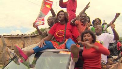 Campaigners on top of a vehicle