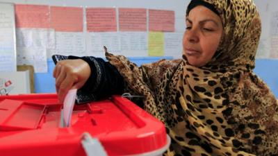 Tunisian woman casting vote