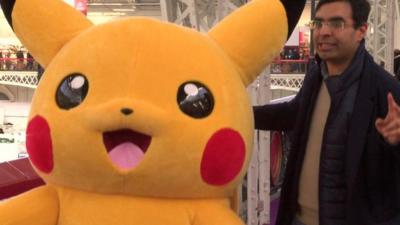 Pikachu dancing with London Toy Fair visitor