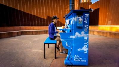 Woman playing piano in Melbourne