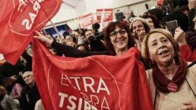 Syriza supporters celebrate as the results come in