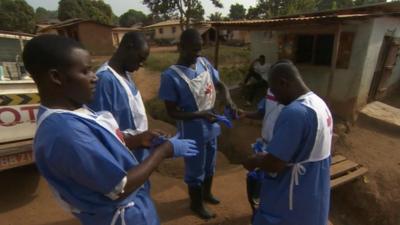 Red Cross volunteers getting ready for work