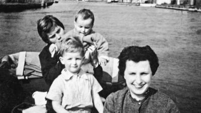 Roger Cohen as a child with his mother and two others on a boat