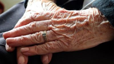 Hands of elderly woman