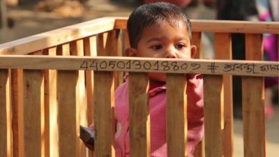 Baby in playpen