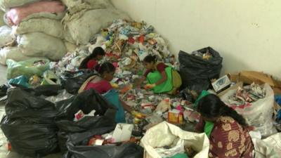 Workers segregating waste