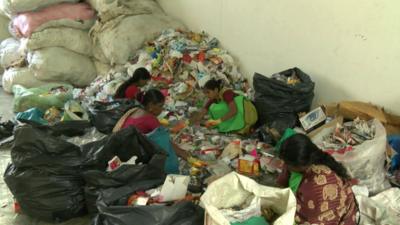 Workers segregating waste