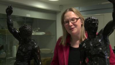 Dr Victoria Avery with statues