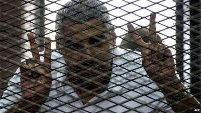 Mohamed Fahmy behind wire