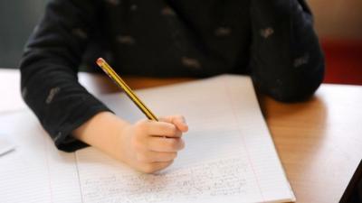 A pupil at work in a classroom