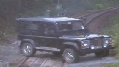 Peter Burns driving across the track