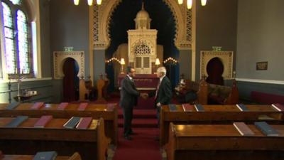 Jani Rashid shakes hands with Rudi Leavor