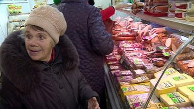 Valentina Golenkina lady at meat counter