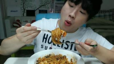 Person eating Noodles in South Korea