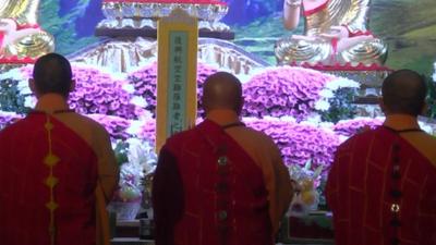 Monks mourn plane crash victims