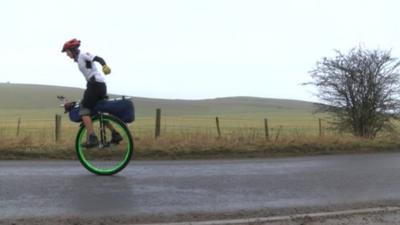 Ed Pratt on a unicycle