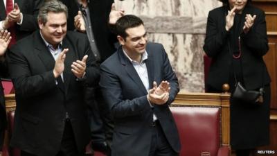 Prime Minister Alexis Tsipras applauding