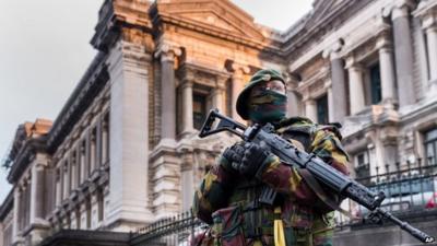 Belgian security officer stands guard near the Palace of Justice